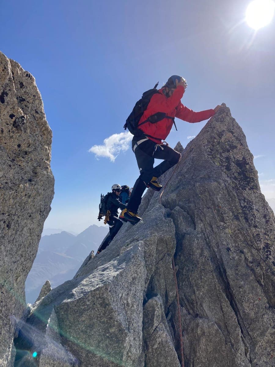 Jérémy Geneste climbing a granite needle in the Mont Blanc massif